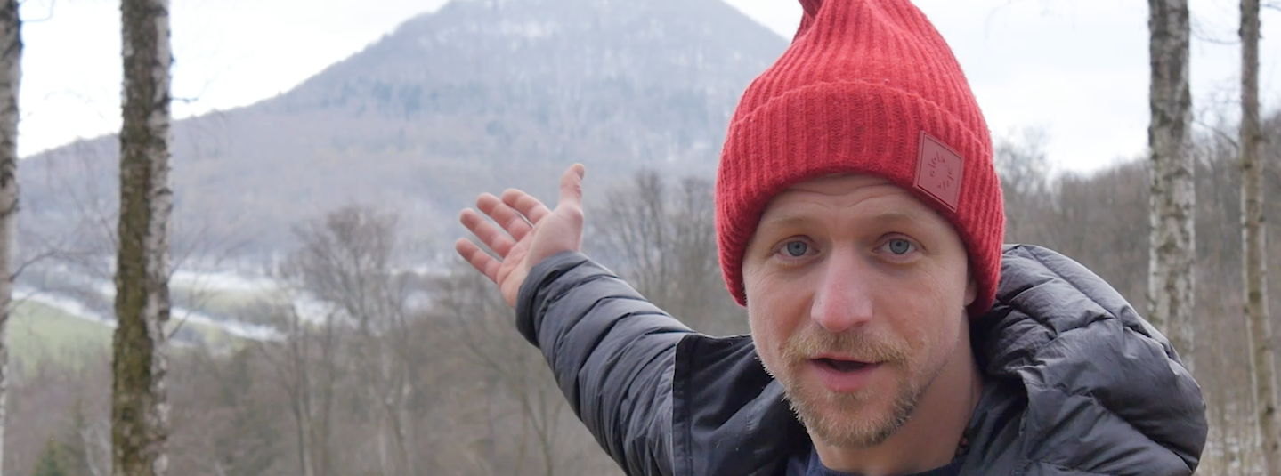 a photo of tomas klus in front of Milešovka mountain