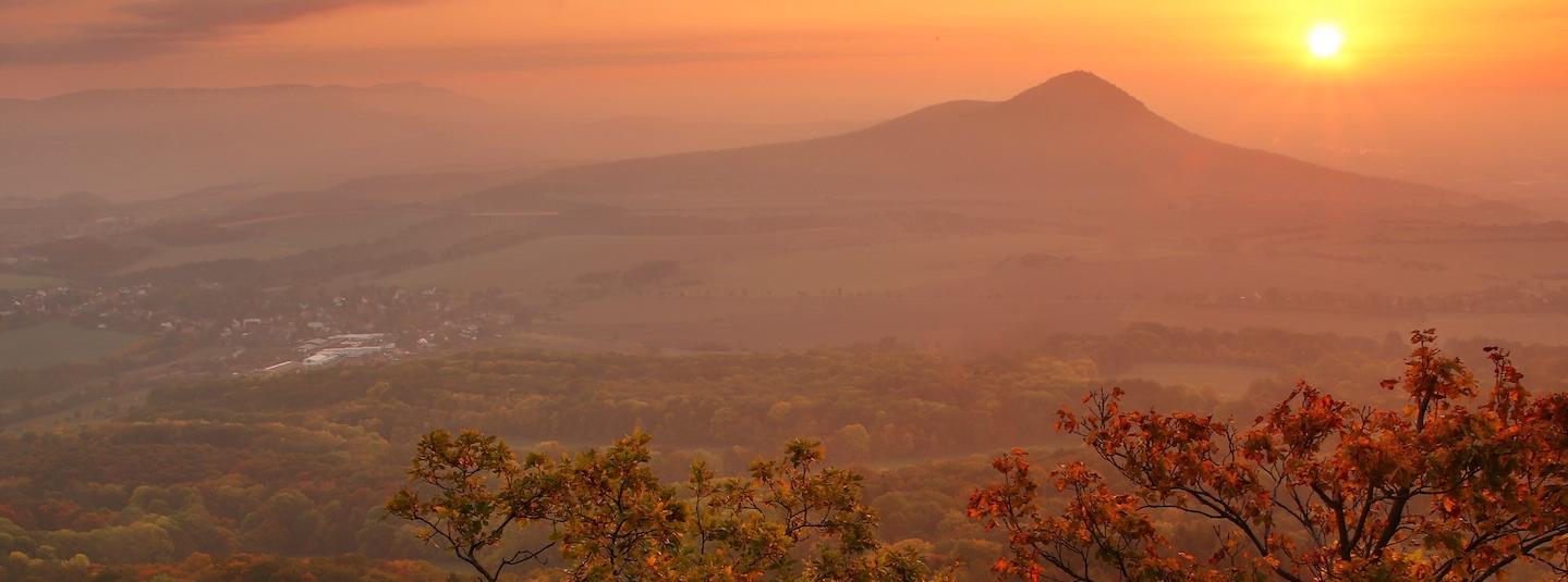 a panorama of a forest and a village